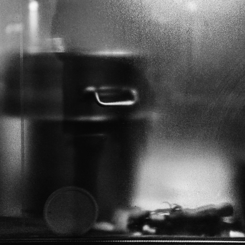 a black and white photo of a stove top