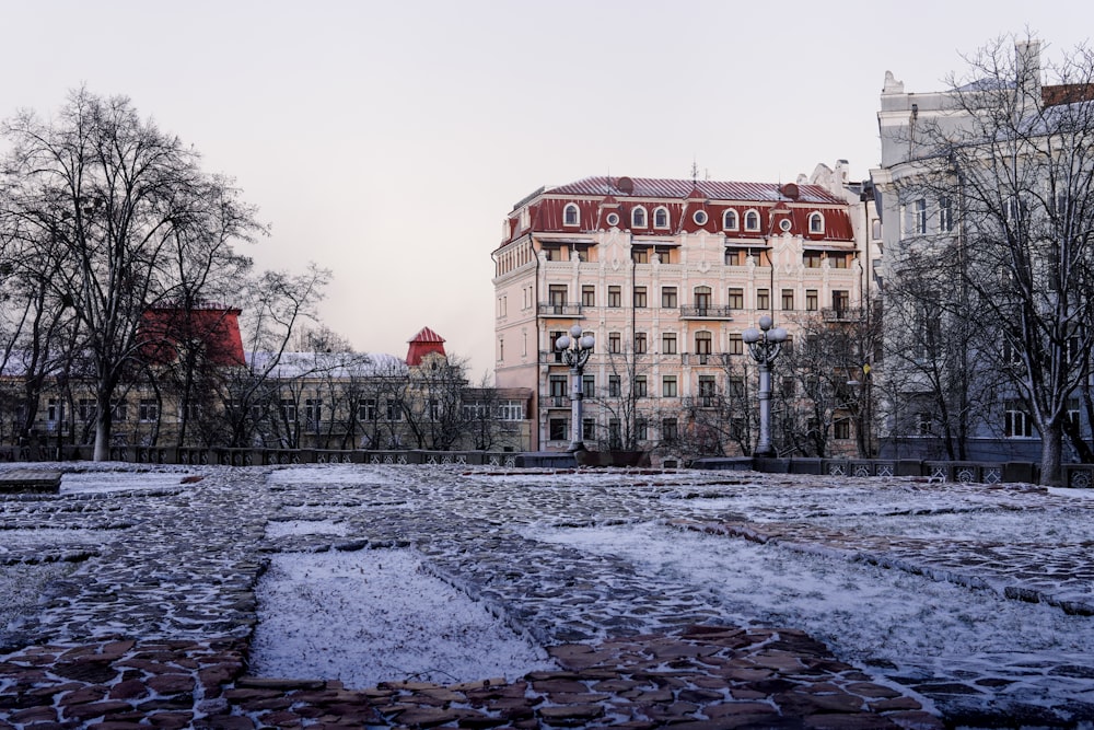 a large building with a lot of snow on the ground