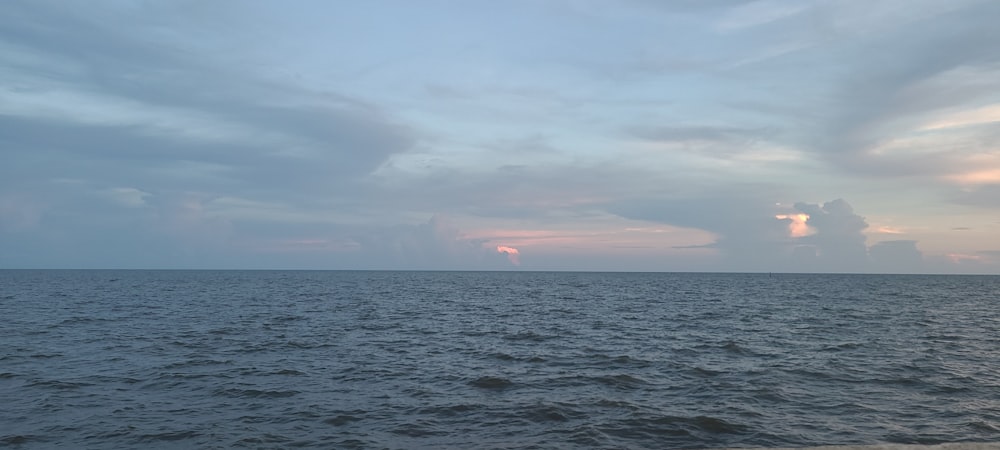 a view of a body of water at sunset
