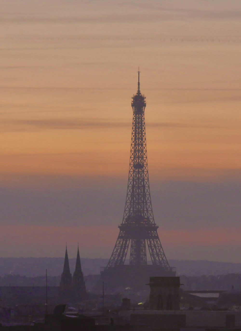 the eiffel tower towering over the city of paris