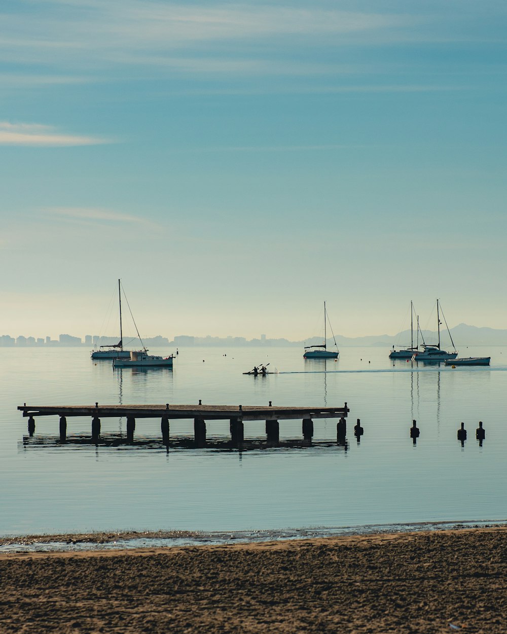 a body of water with boats in the background