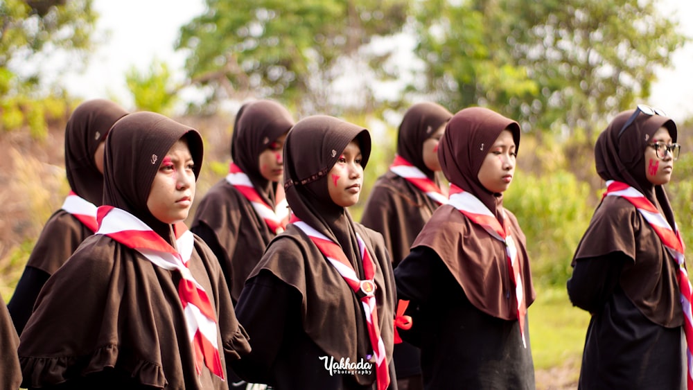 a group of young women standing next to each other