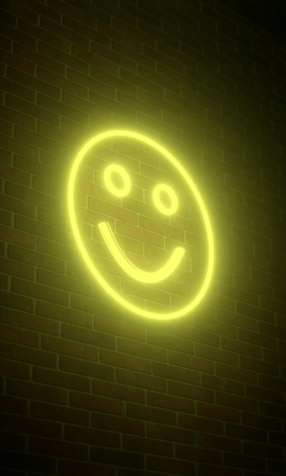 a smiley face neon sign on a brick wall