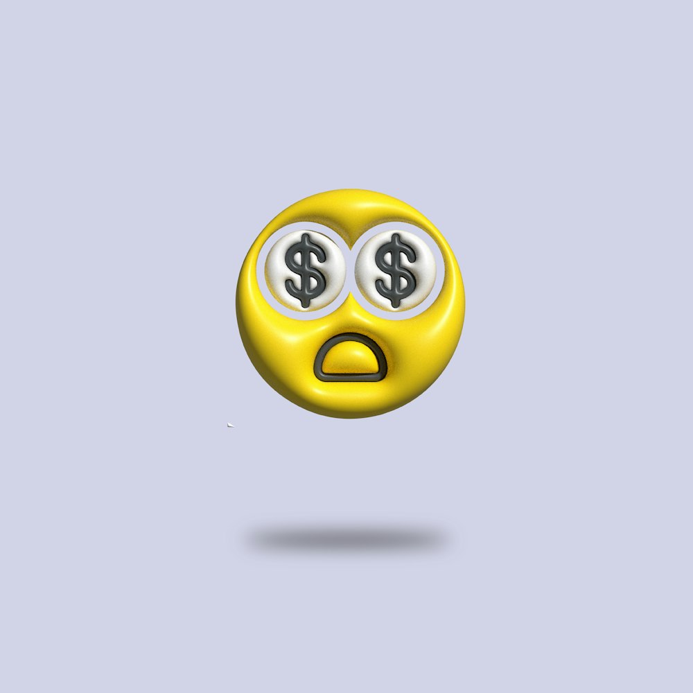 un visage souriant jaune avec deux yeux et un signe de dollar dessus