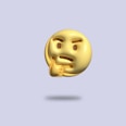 a gold emotiction of a thinking smiley face