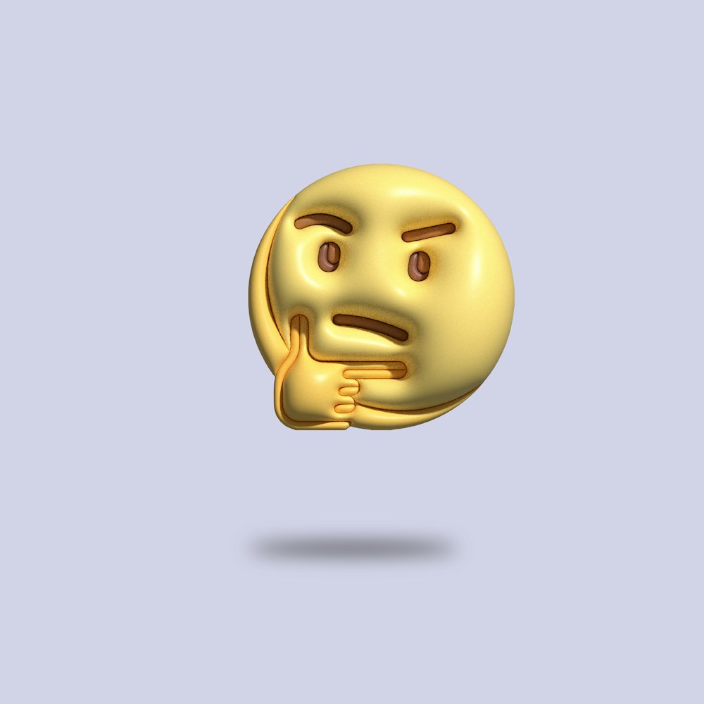 a gold emotiction of a smiley face