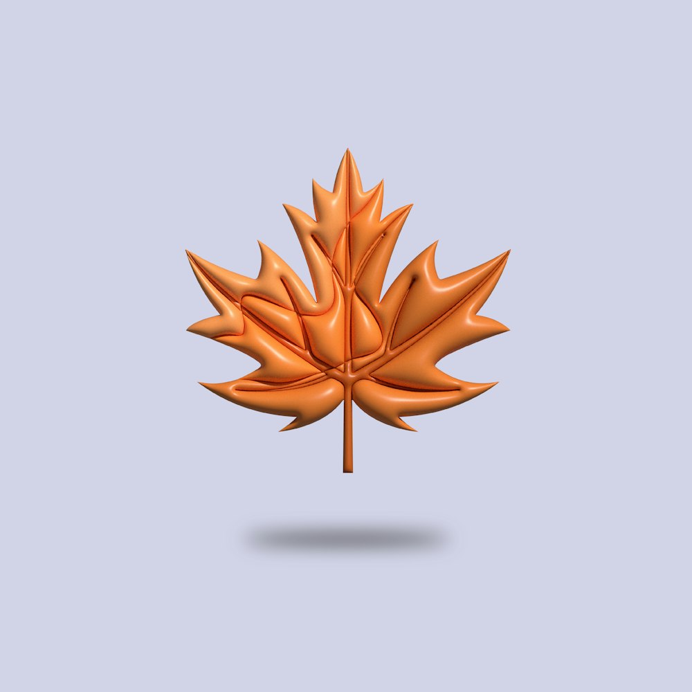 an orange maple leaf on a blue background