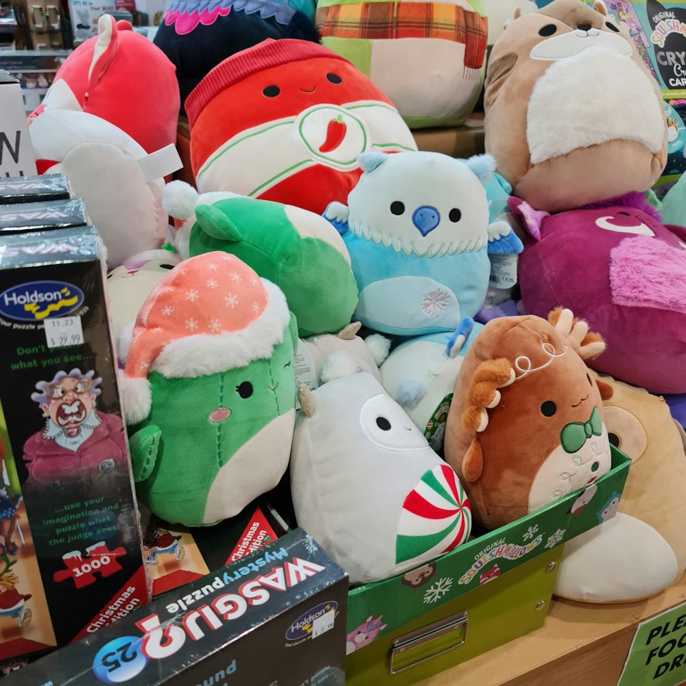 a pile of stuffed animals sitting on top of a table