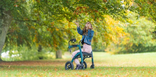 a woman standing next to a child in a stroller