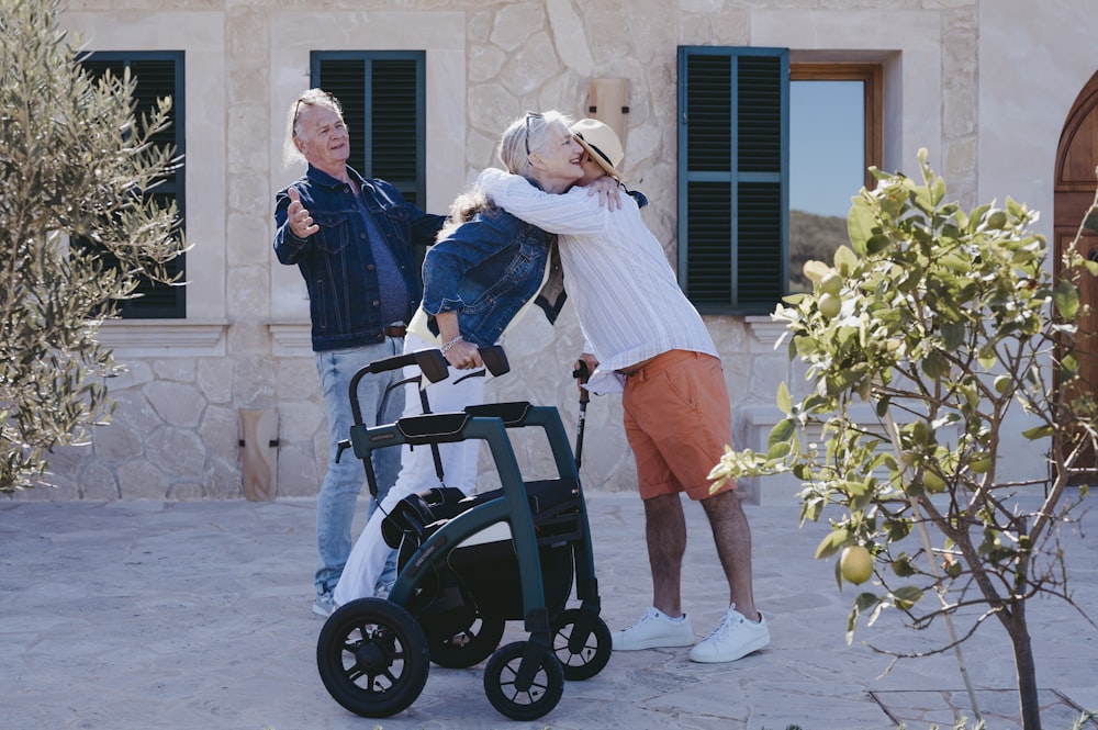 a man pushing a woman in a wheel chair