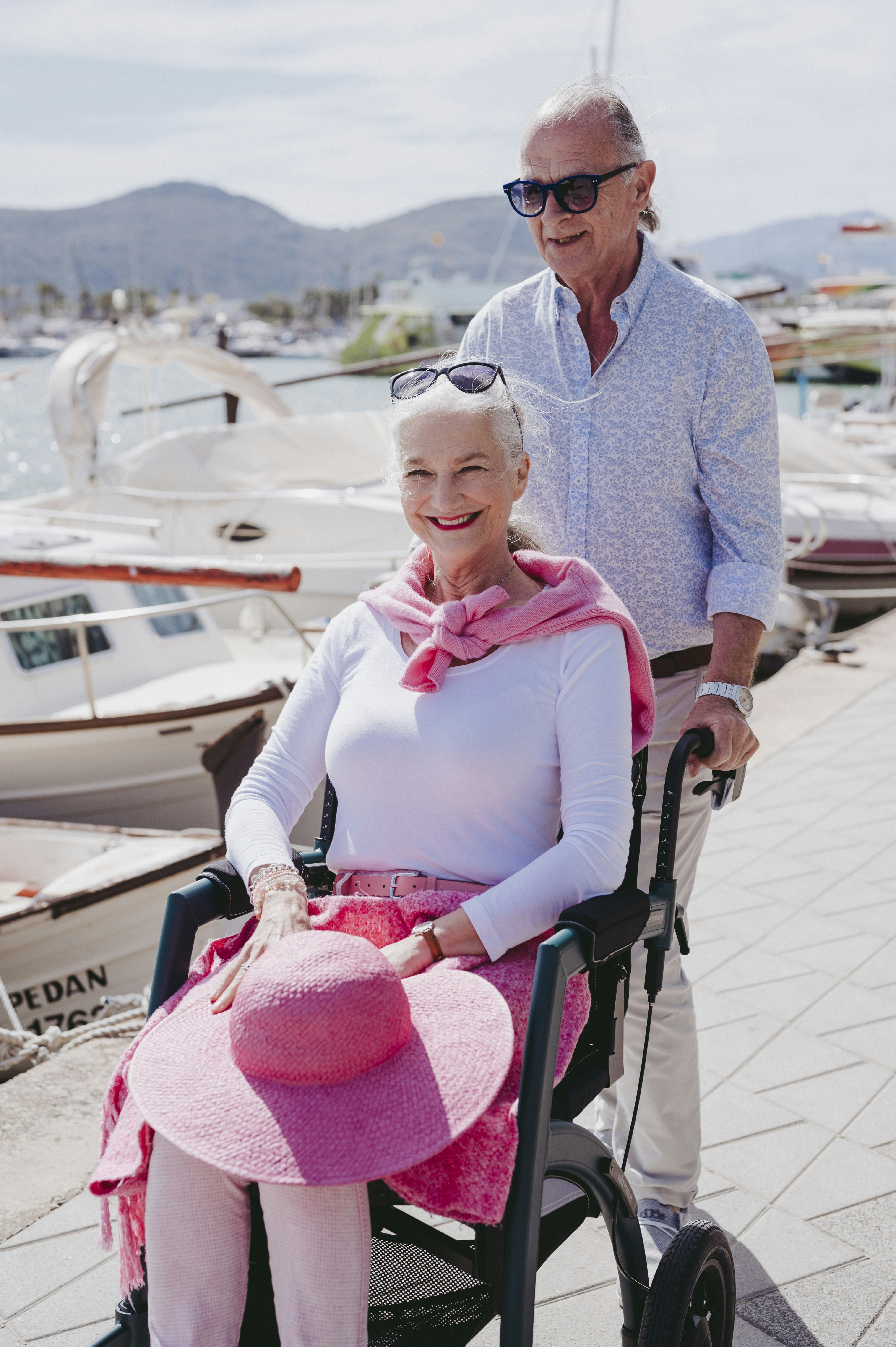 a woman in a pink hat and a man in a blue shirt