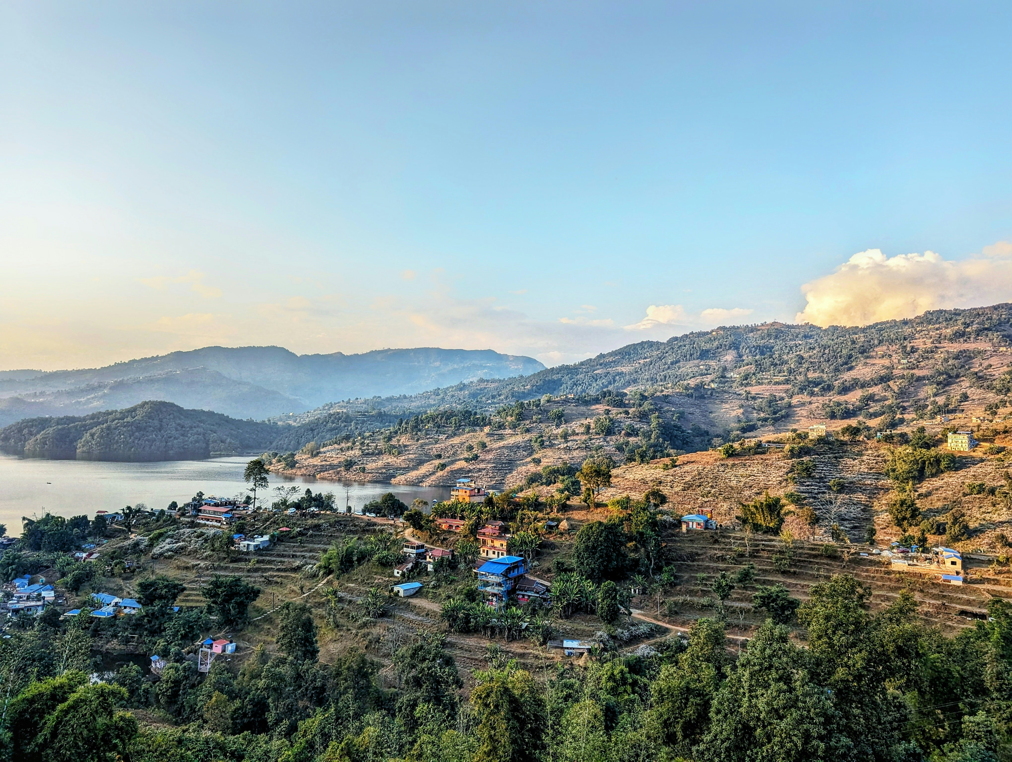 a scenic view of a lake surrounded by mountains