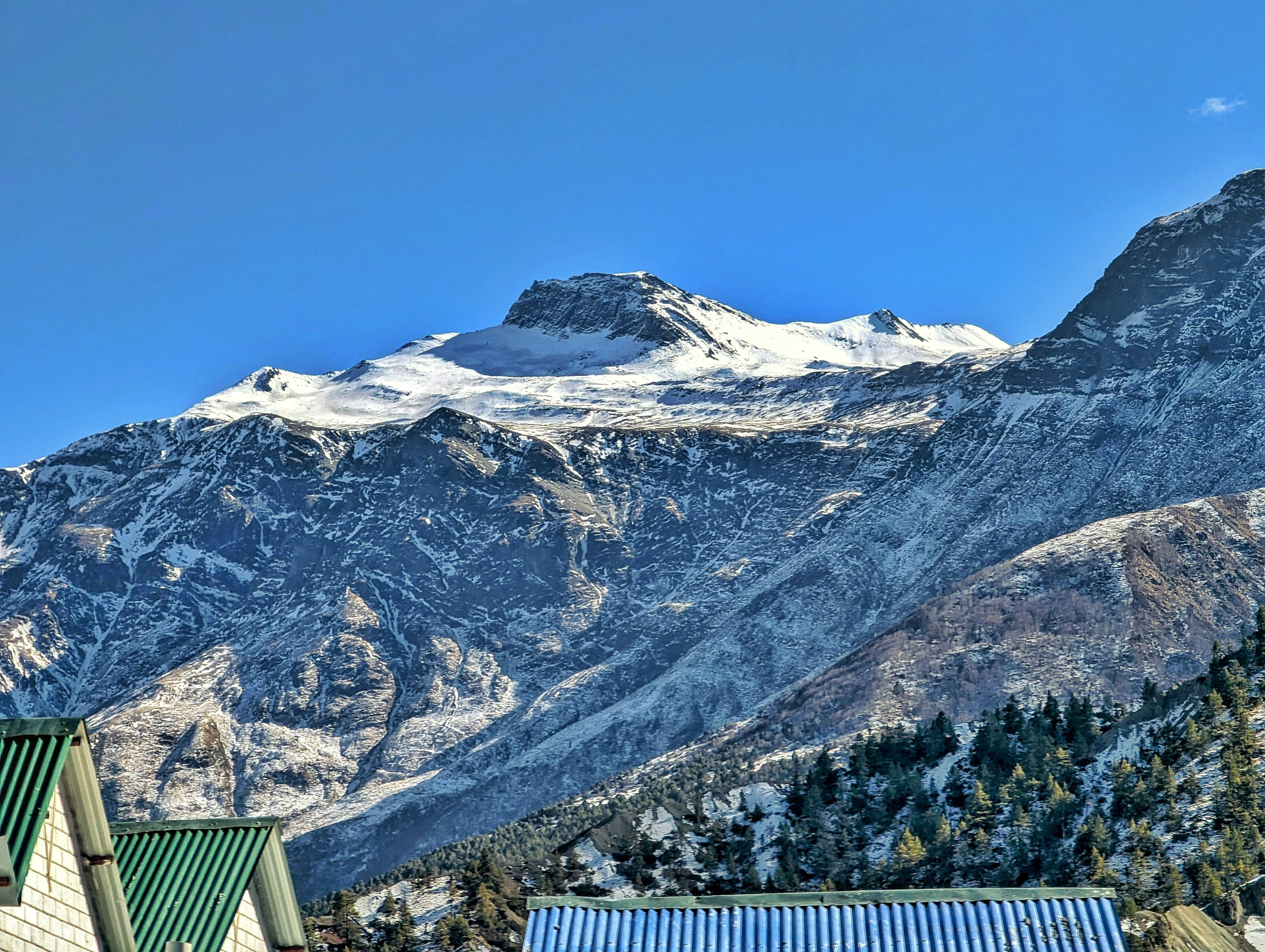 a snow covered mountain is in the distance