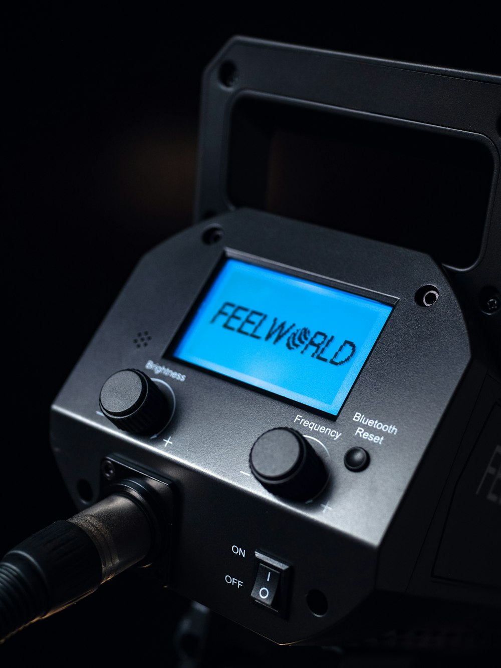 a close up of a camera with the word feel world on it