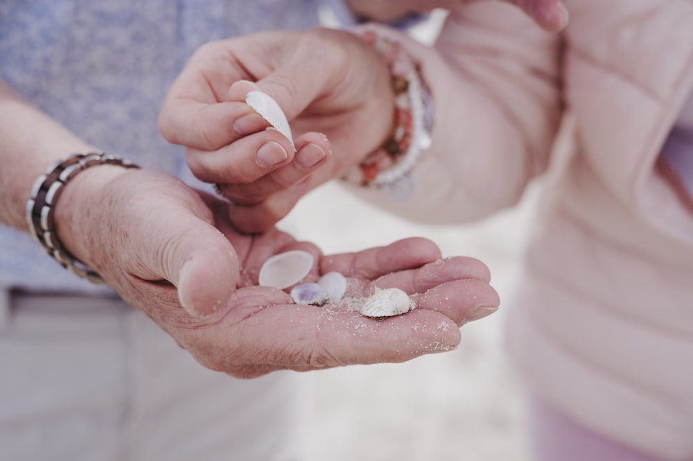 a couple of people holding something in their hands