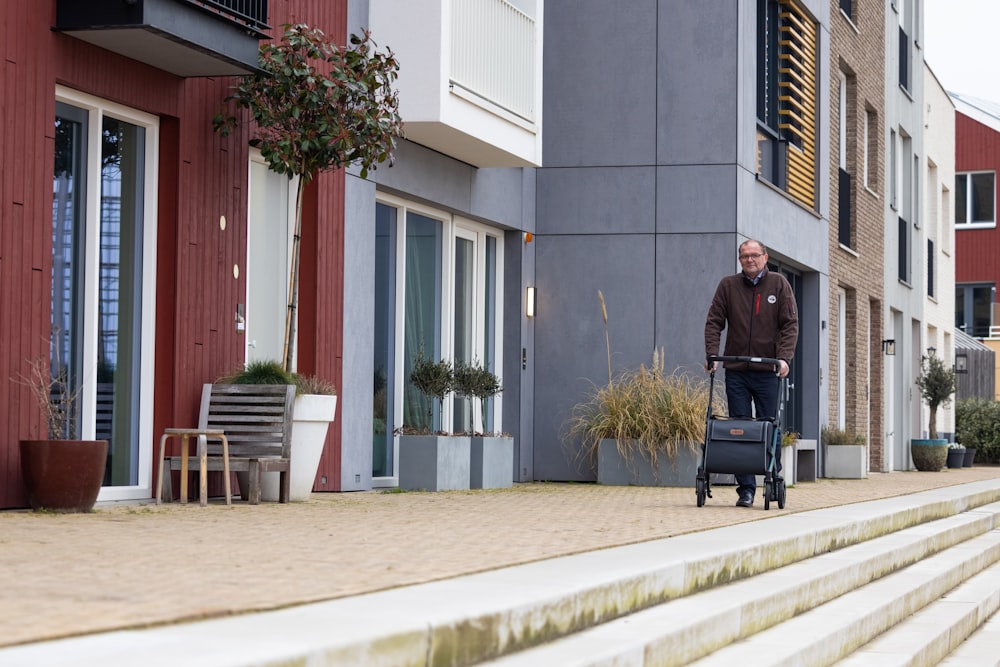 a man walking down a street with a suitcase