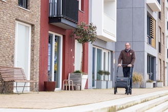 a man with a suitcase walking down the street