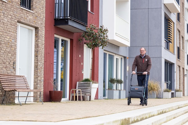 a man with a suitcase walking down the street