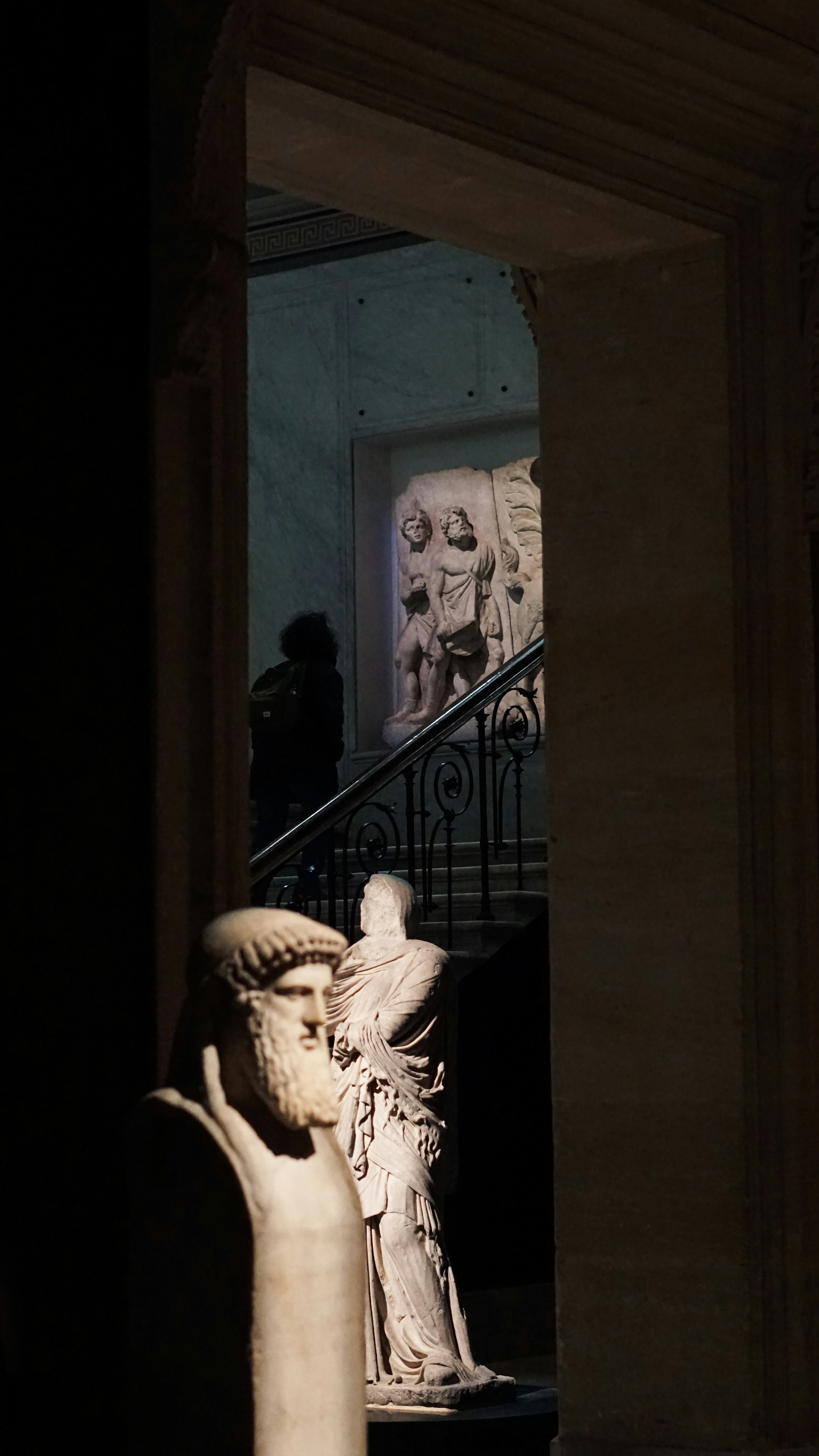 a statue of a woman holding a bird in her hand