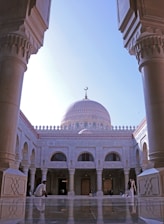 a large white building with a dome on top of it