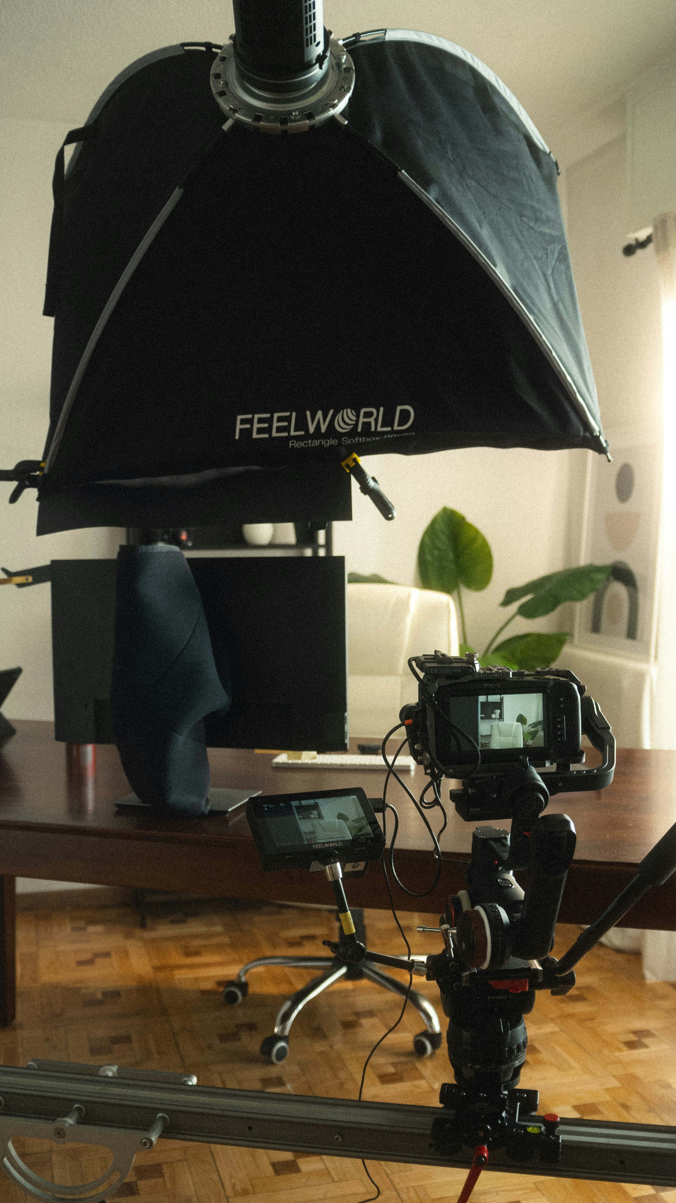 a camera set up on a wooden table