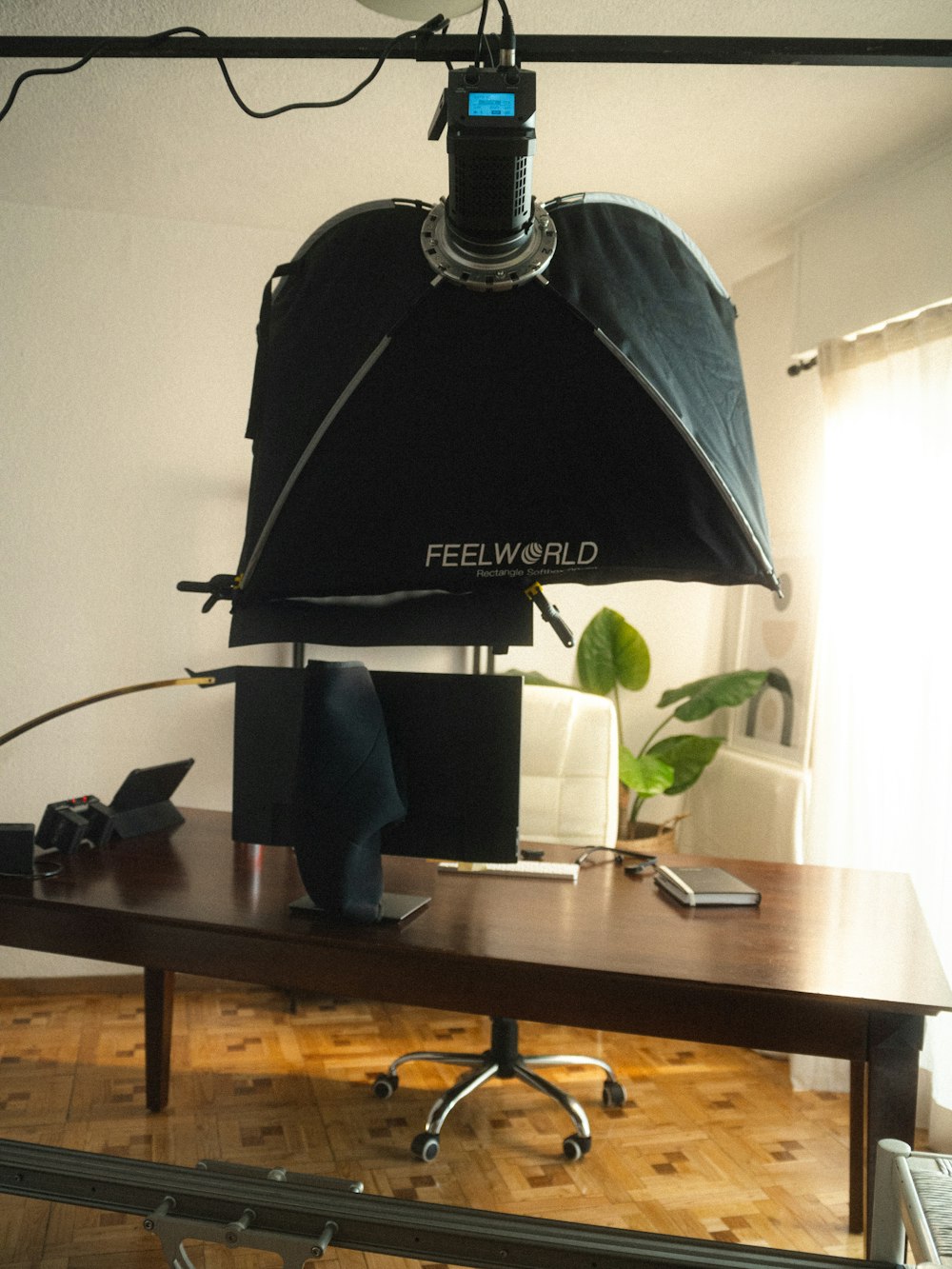 a photo shoot of a desk with a lamp on top of it