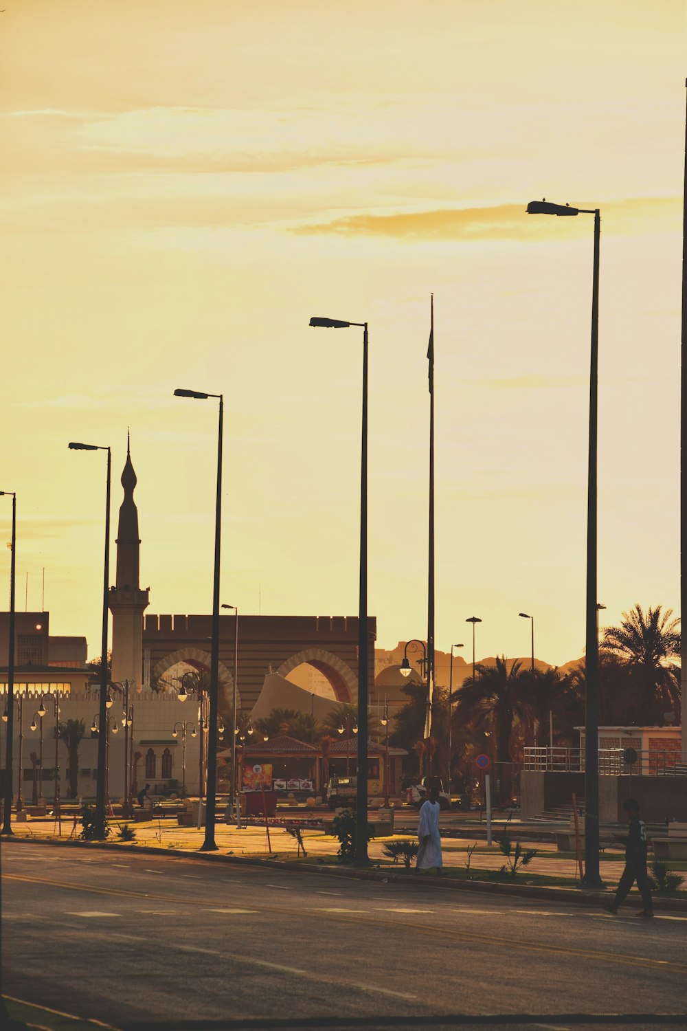 a city street with a clock tower in the background