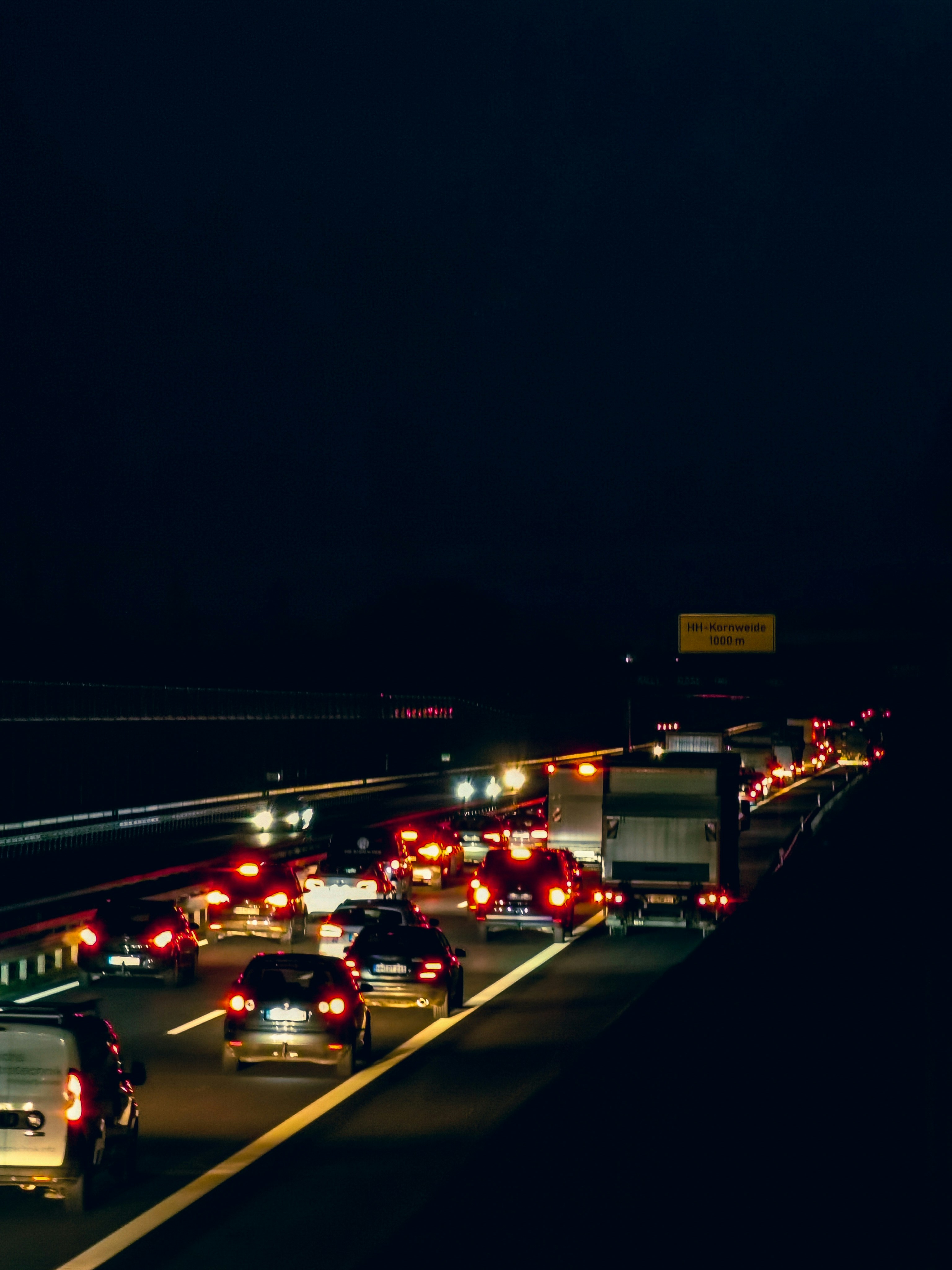 a highway filled with lots of traffic at night
