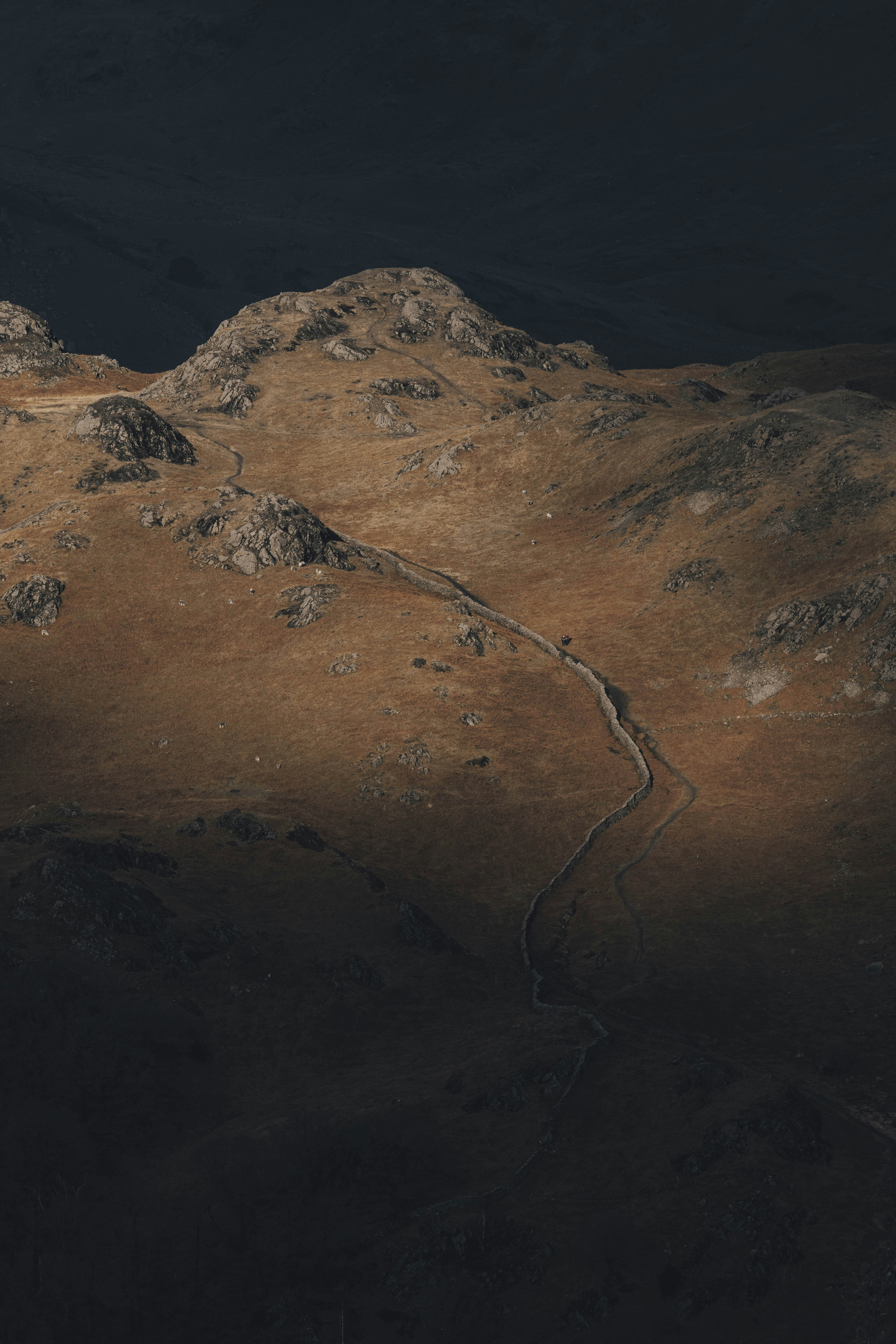 a view of a mountain with a road going through it