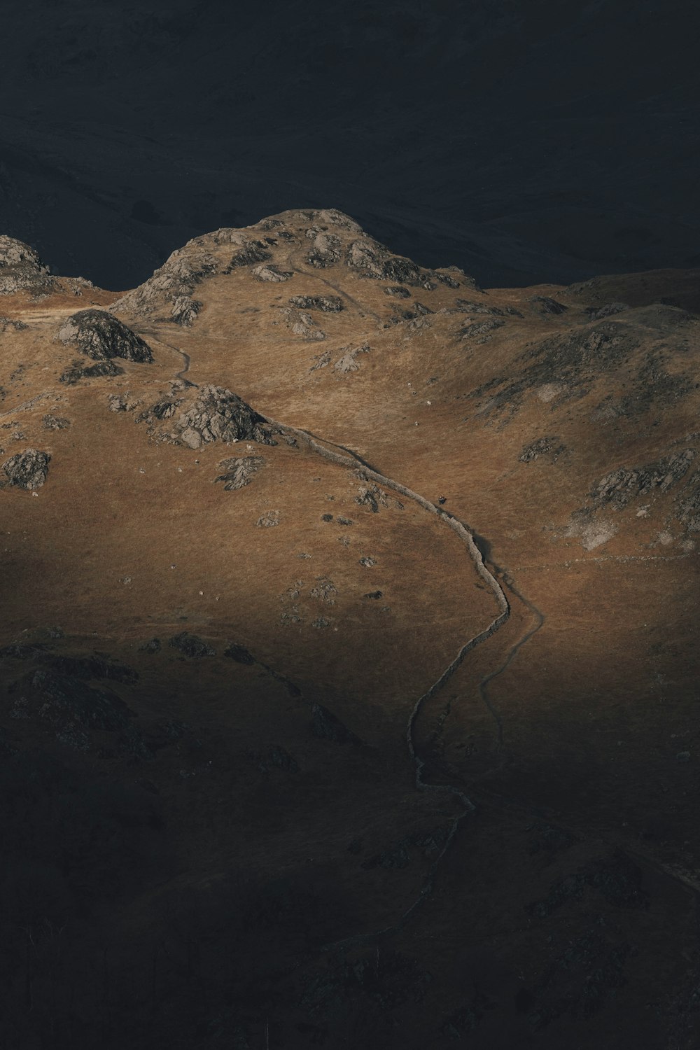 a view of a mountain with a road going through it