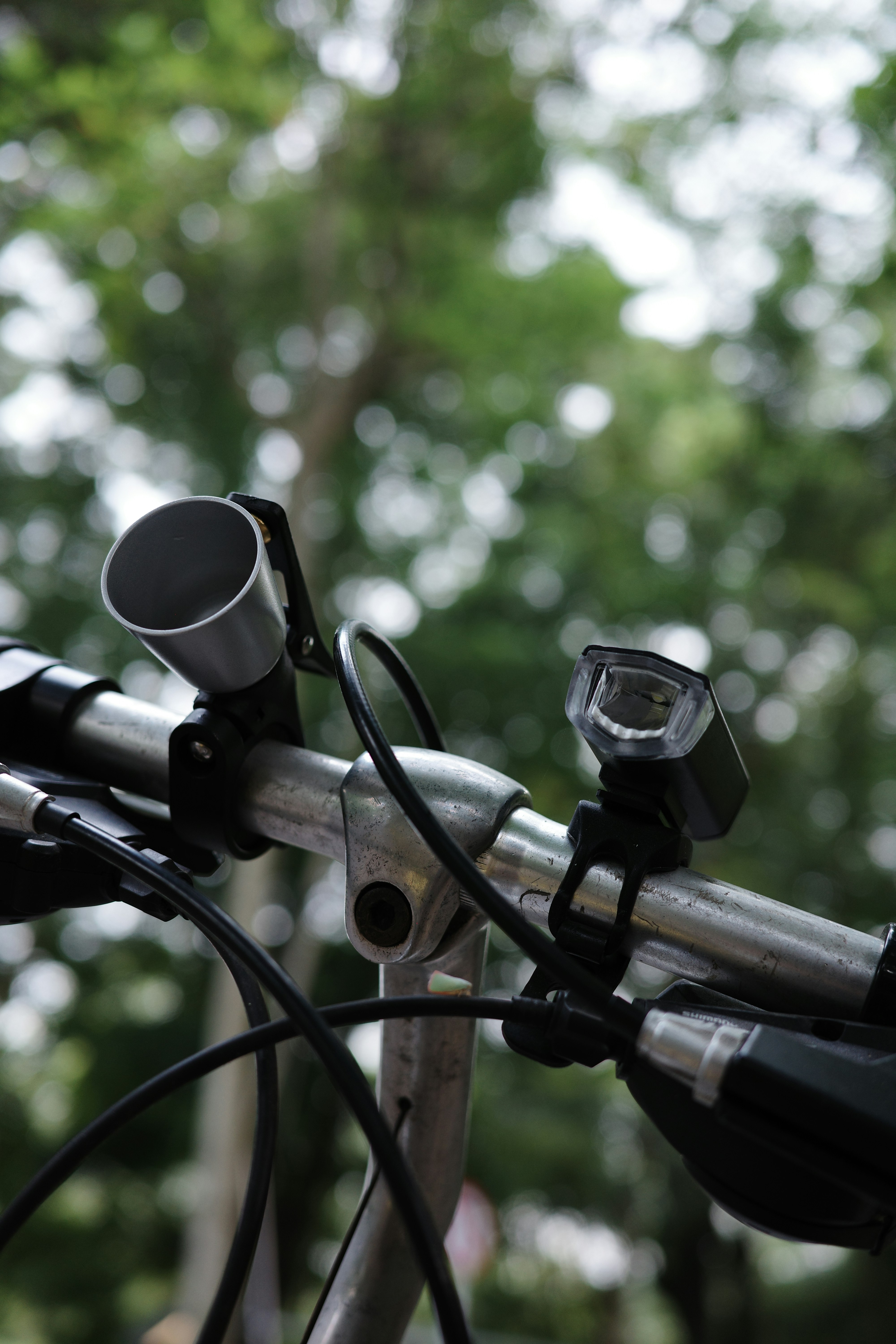 a close up of a bike handlebar with a camera attached to it