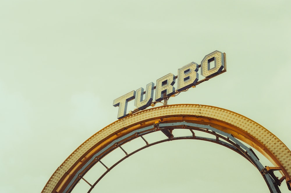 a sign that reads turbo on top of a roller coaster