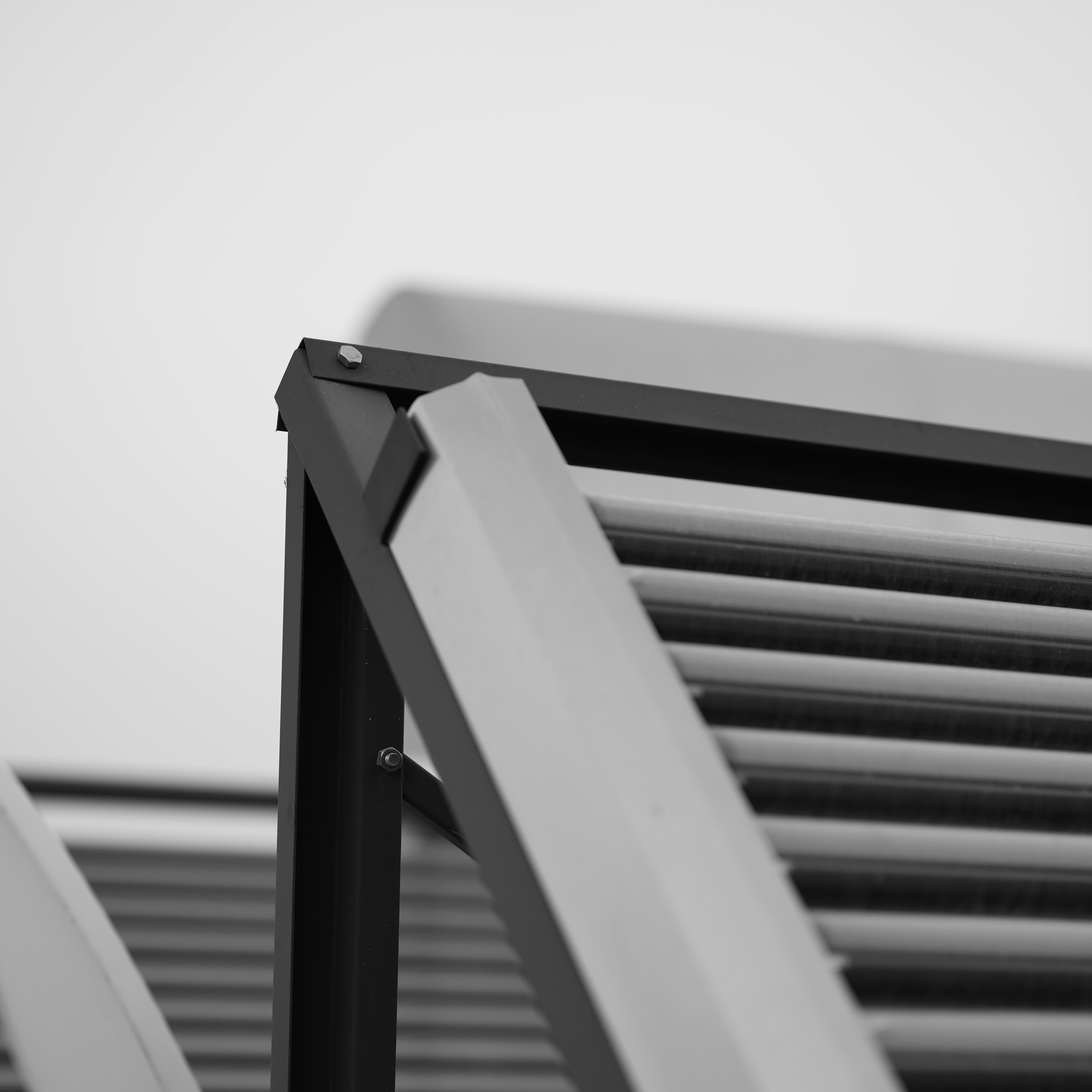 A black and white photo of a closed window - louvre free entry gets