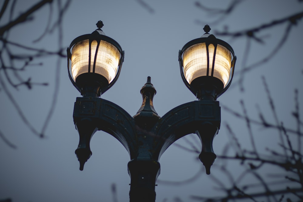 a street light with two lights on top of it