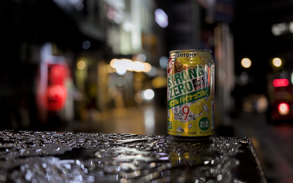 a can of beer sitting on top of a table