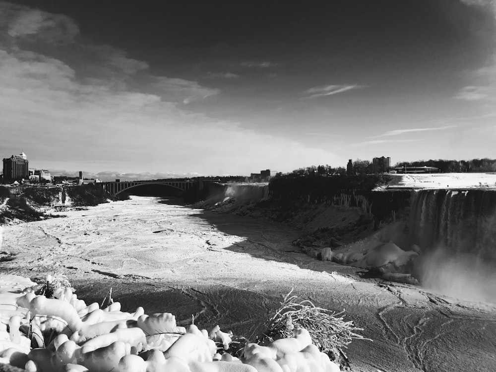 a black and white photo of a waterfall