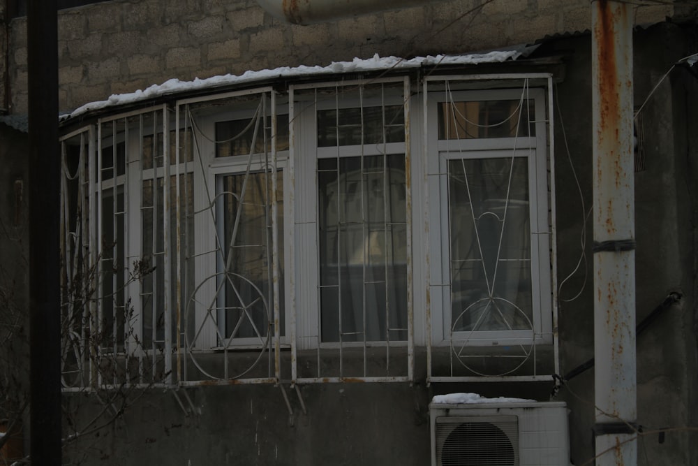 an old building with a window and air conditioner