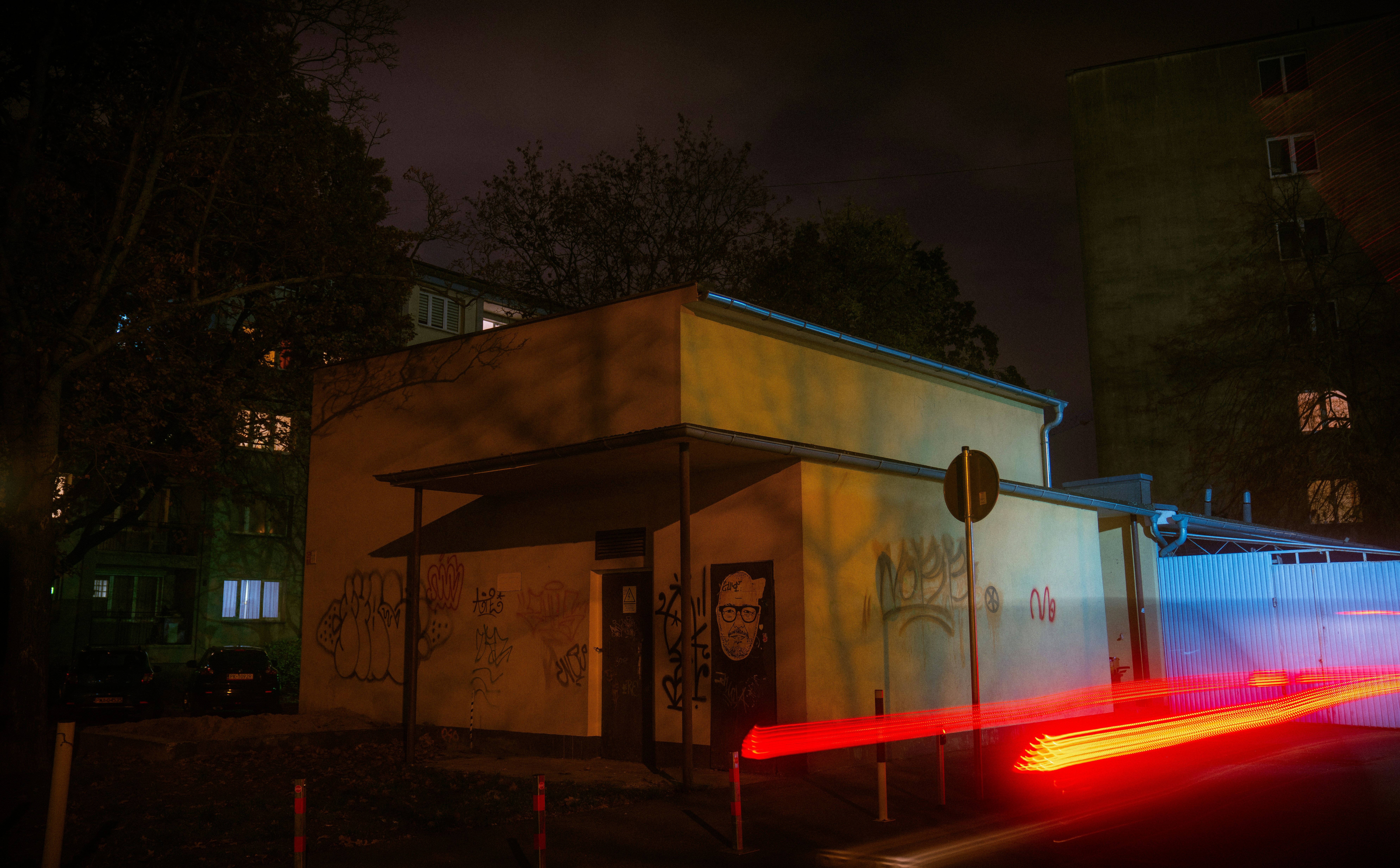 Electric SUV charging at a public DC fast charging station at night
