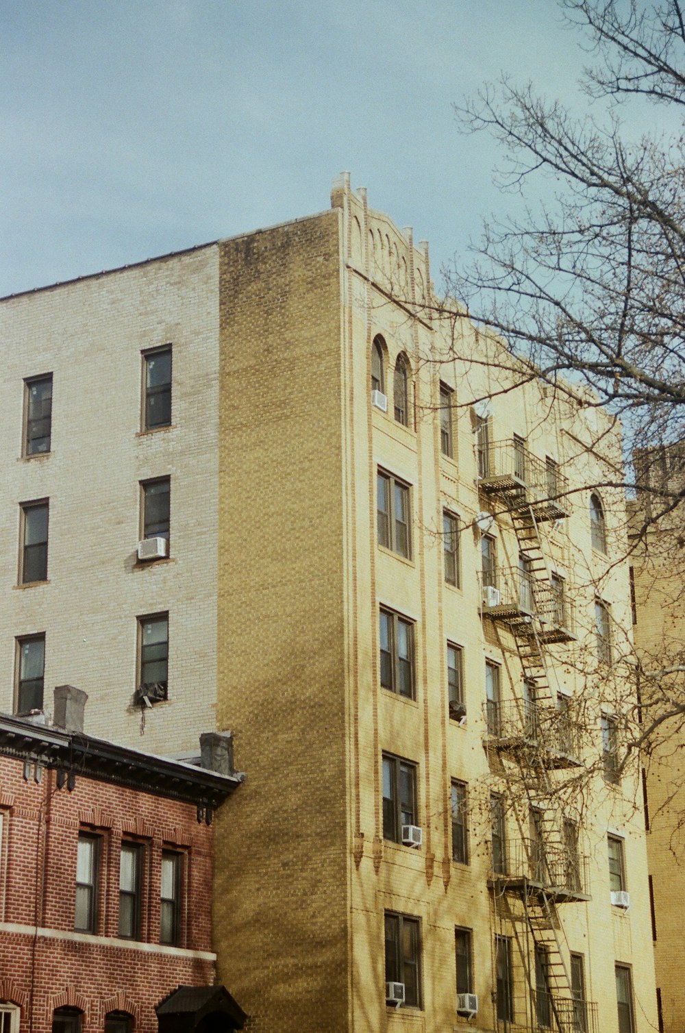 a tall building sitting next to a tall brick building