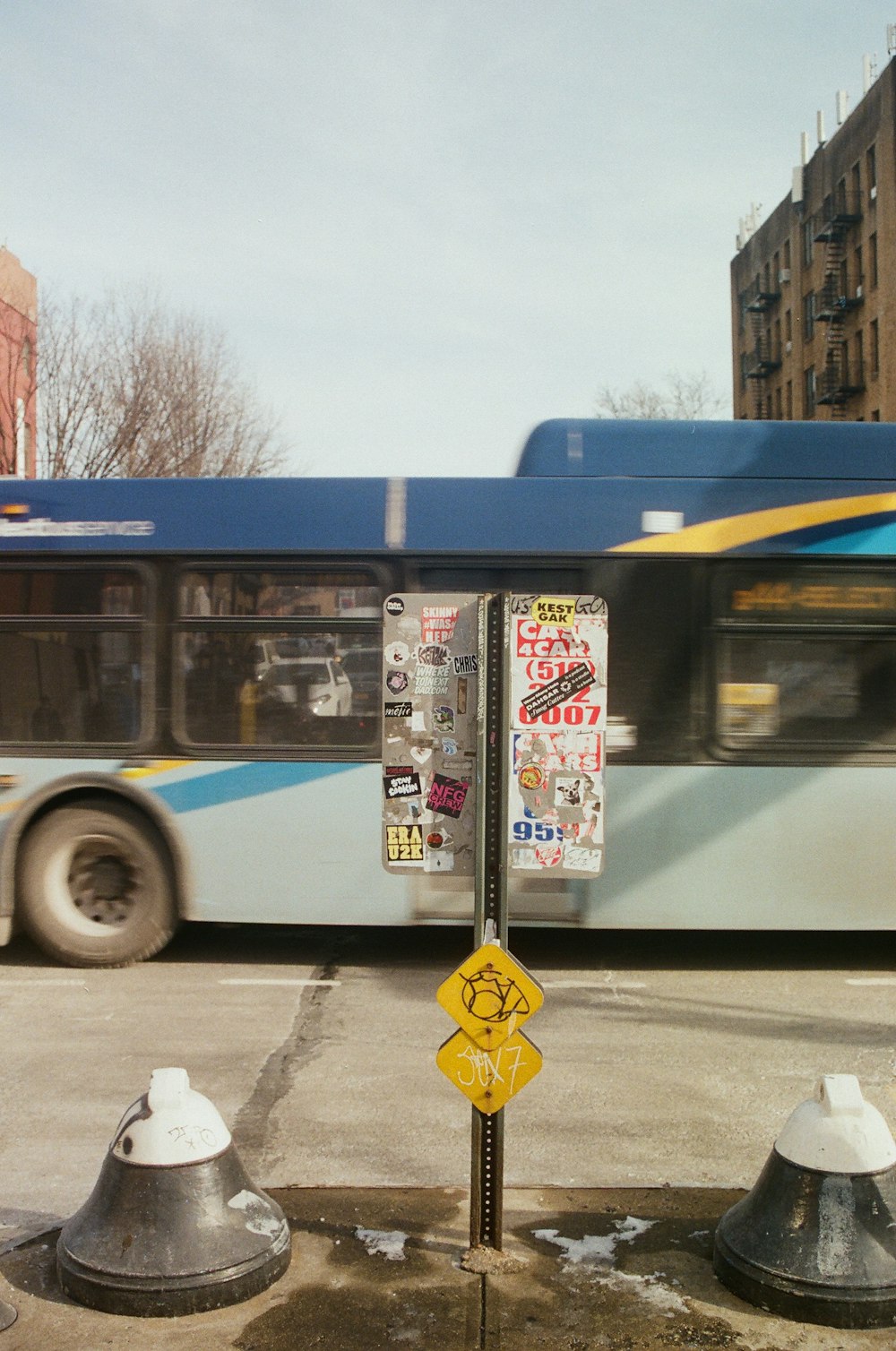 a bus driving down a street next to a parking meter