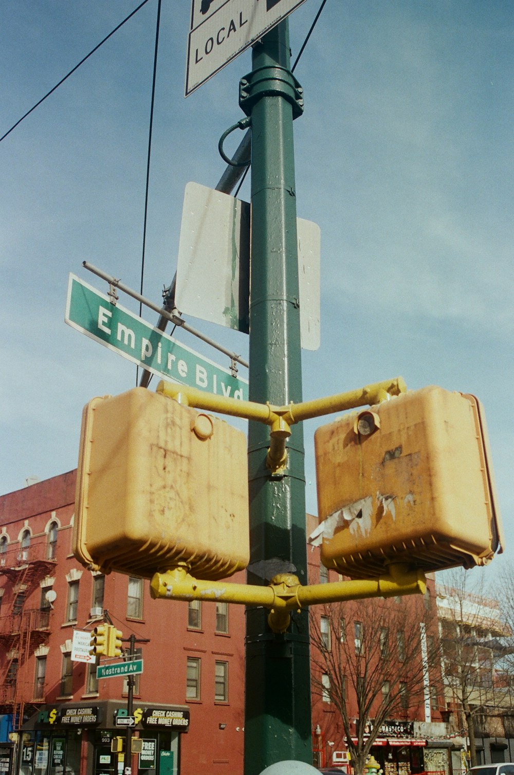 a couple of suitcases that are on a pole