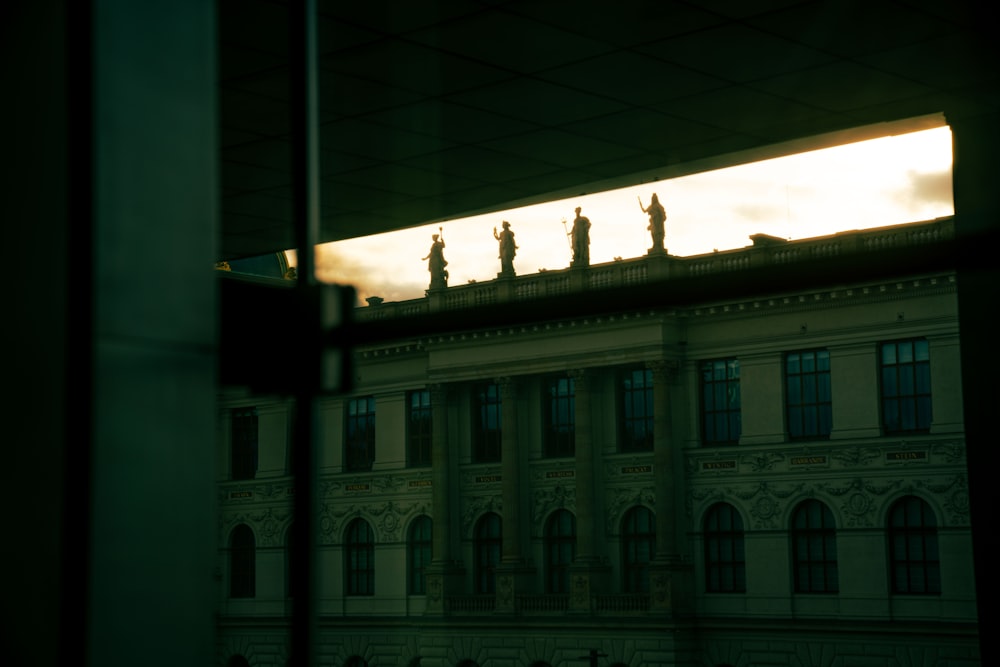 a building with statues on top of it