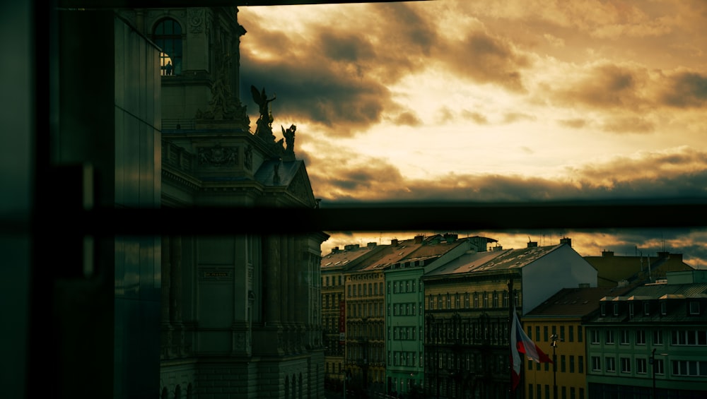 a view of a clock tower through a window