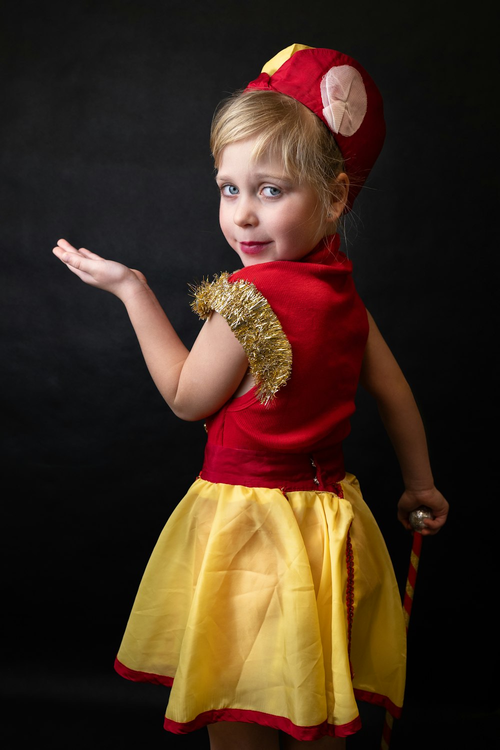 a little girl dressed up in a costume