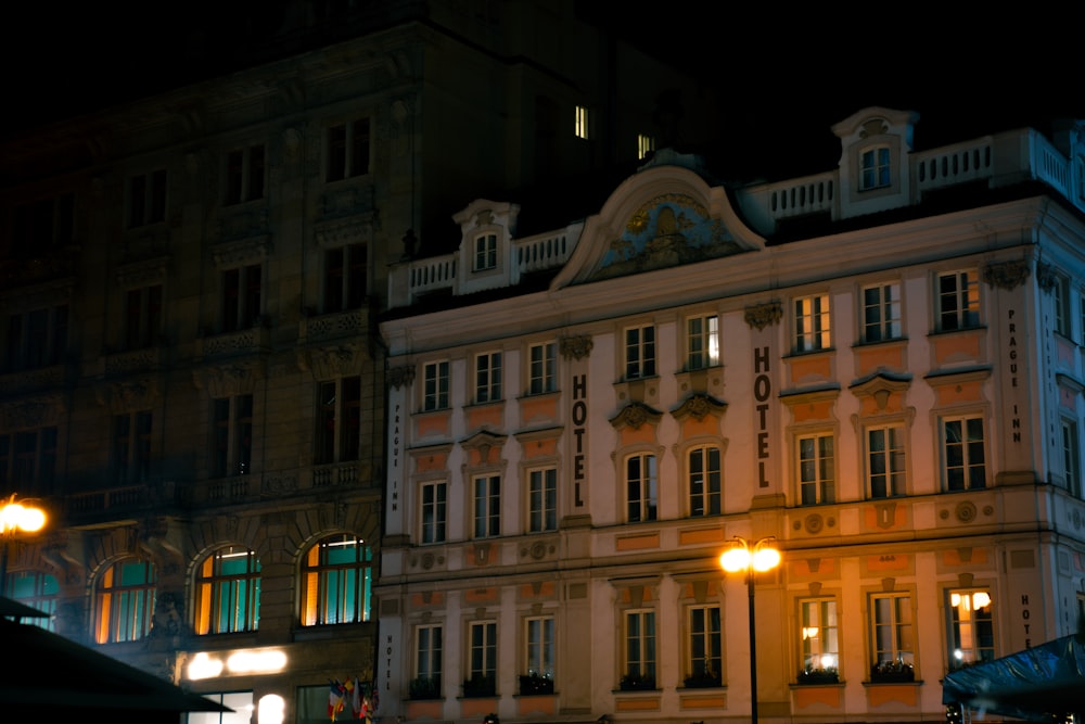 a building lit up at night with street lights