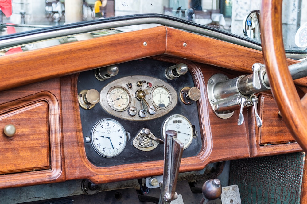 the dashboard of a car with a lot of gauges