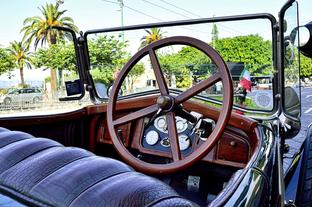 a car with a steering wheel and a leather seat