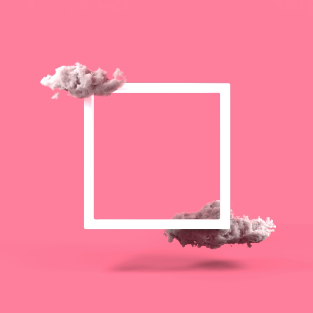 a pink background with a white square in the middle