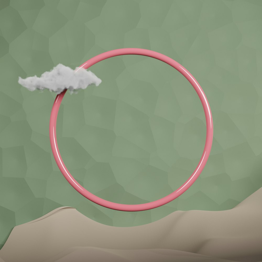 a pink ring with a cloud floating out of it