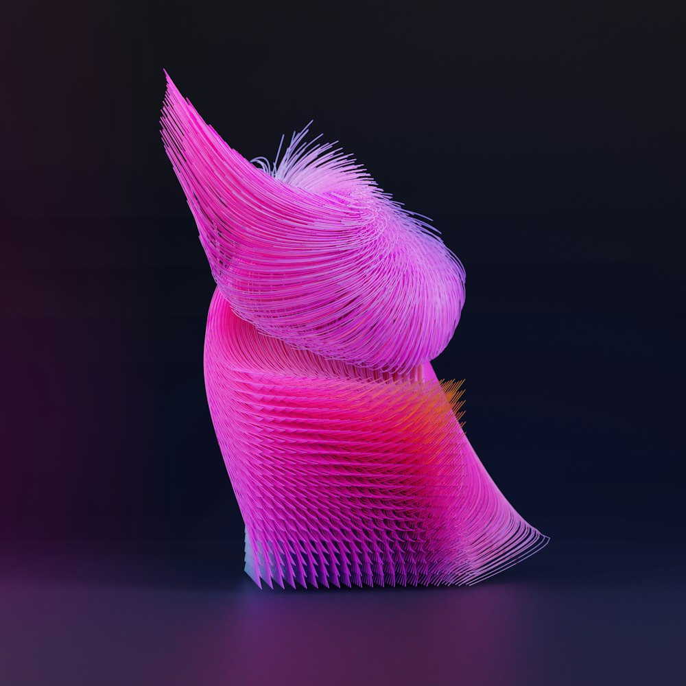 a purple and pink sculpture on a black background
